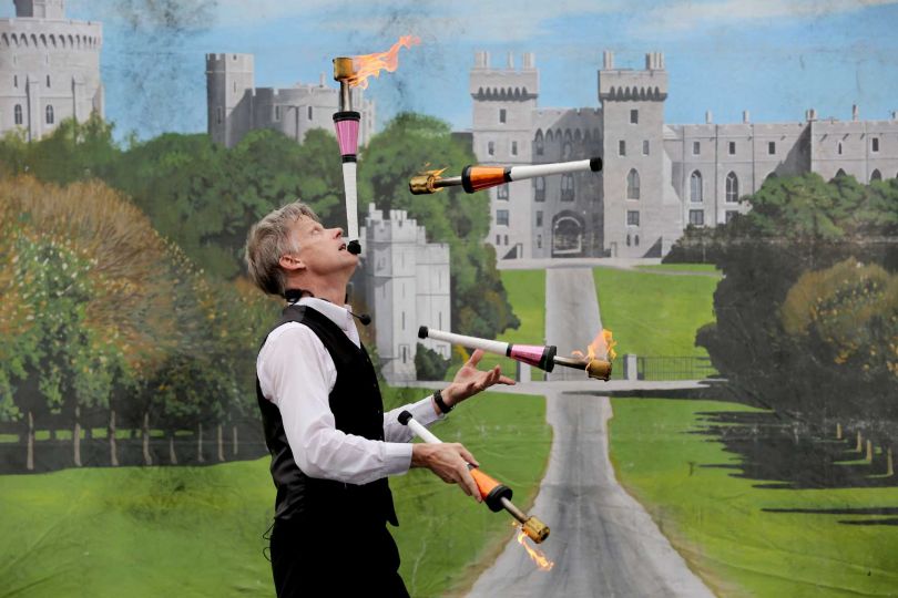 Brian Wendling man juggling fire batons