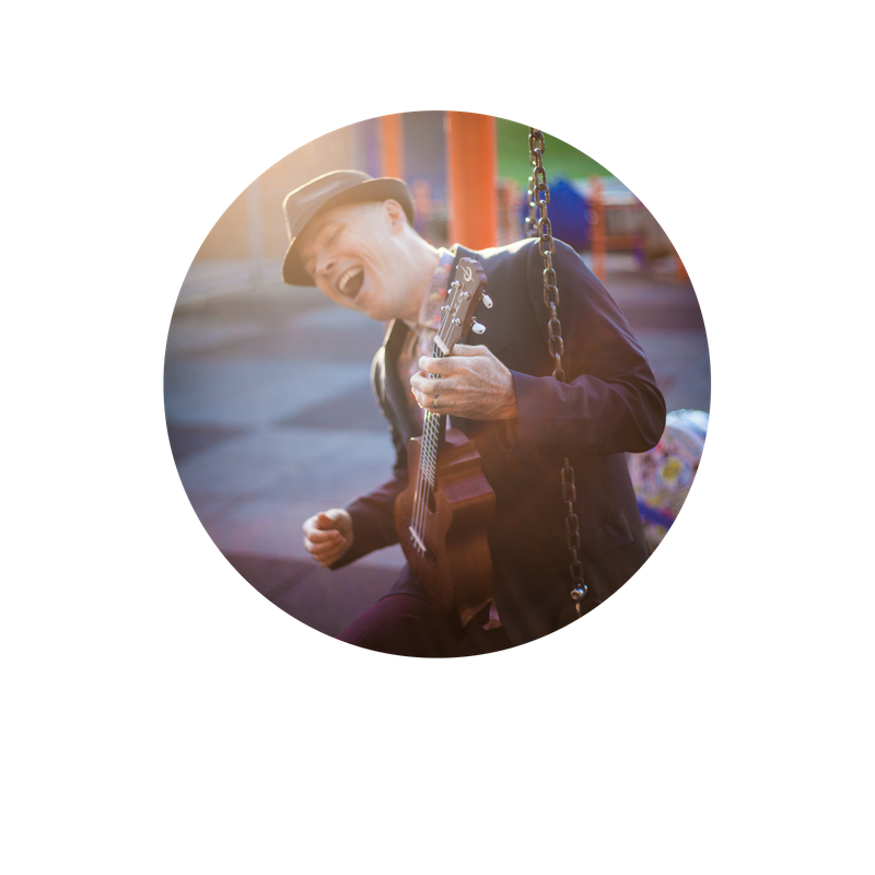 Dino circle Man singing and playing guitar